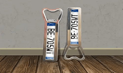 two bottle opener magnets on the floor