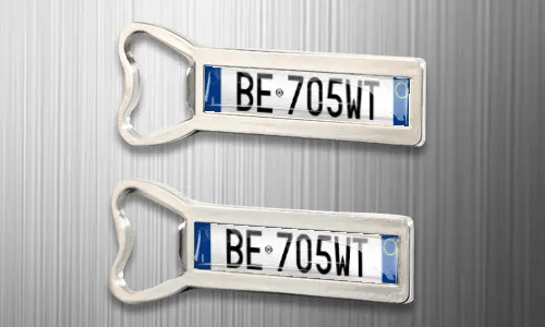 two magnet bottle openers on the fridge