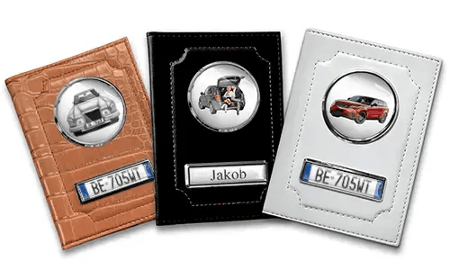 Three personalized car document holders with custom designs