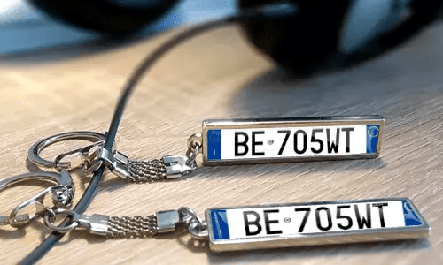 Personalized metal keychains with custom text and license plate style tags