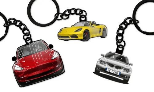 Personalized keychains displaying three different car models in red, yellow, and blue