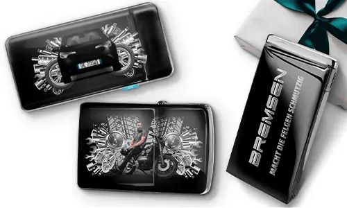 Sleek gift boxes featuring a blue car and a biker surrounded by metallic gears. One box reads 