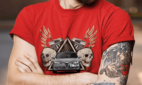 Red T-shirt with white SUV graphic, flanked by skulls and pistons, golden wings behind, worn by tattooed person
