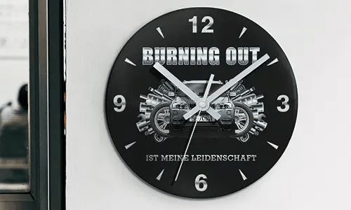 Wall clock with motorcycle and engine graphics, BURNING OUT IST MEINE LEIDENSCHAFT text on black face