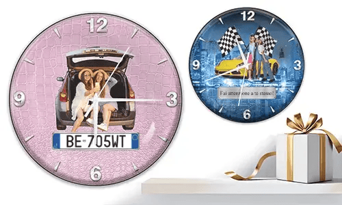Two wall clocks with female figures and cars: left with trunk scene on pink texture, right with yellow sports car and racing flags over cityscape