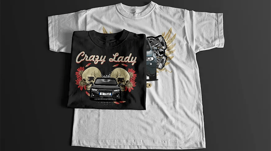 Black T-shirt with stylized car front, skulls, engine parts, golden wings, and BORN TO DRIVE banner